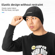 Black thermal cycling skull cap worn by model, snug elastic fit and logo