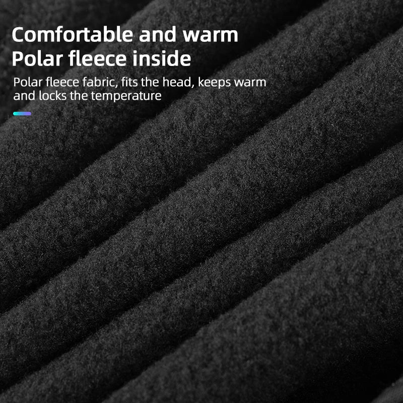 Black polar fleece-lined thermal skull cap fabric close-up, textured surface